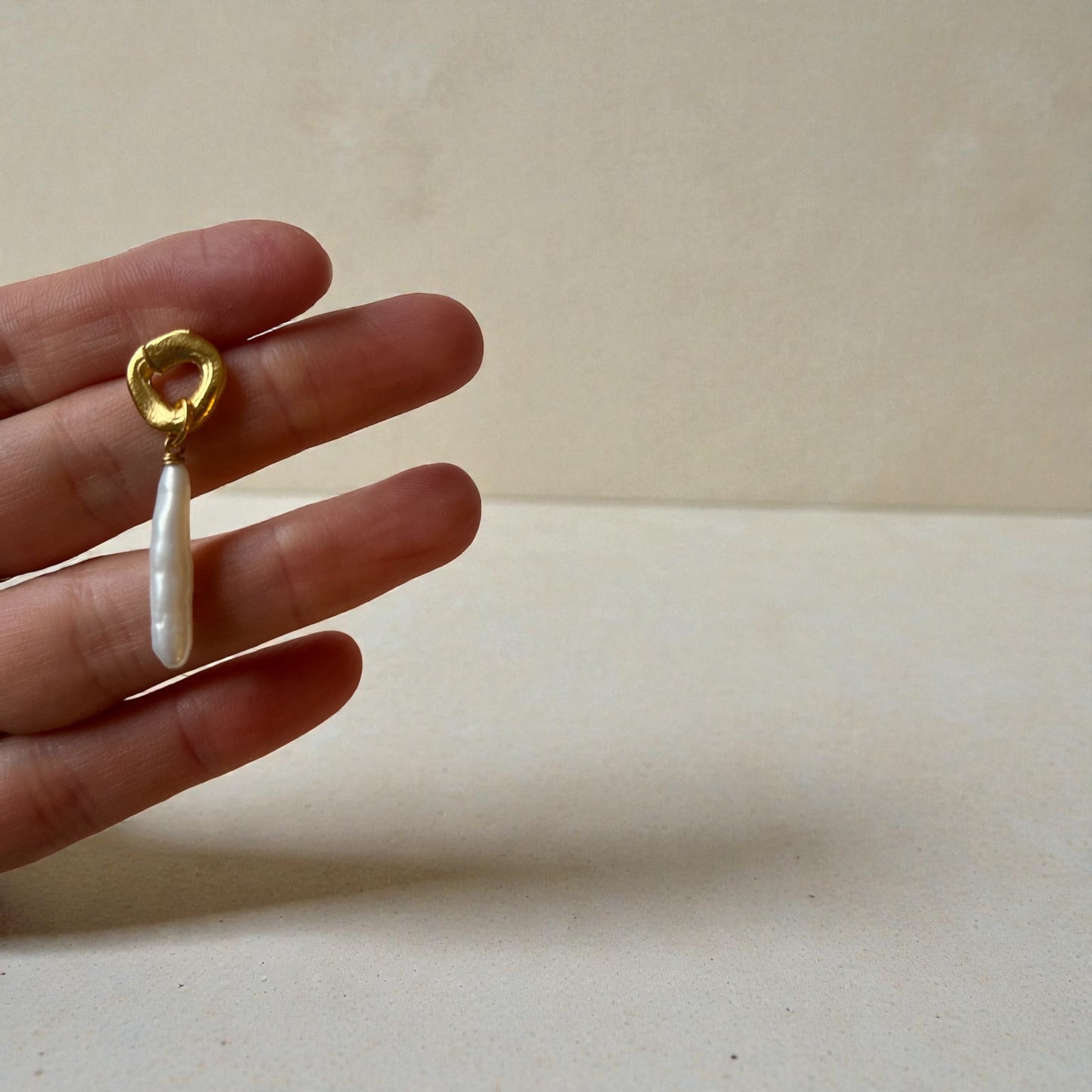 cycles with pearl drop earrings