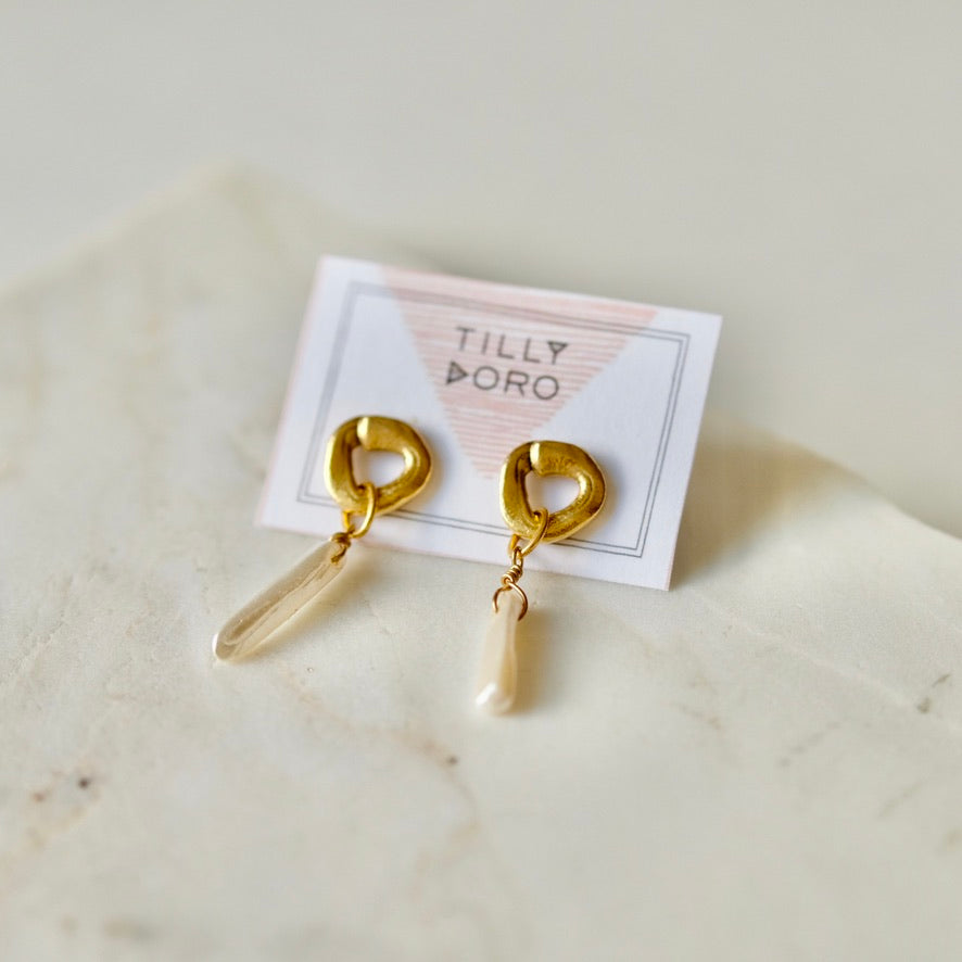 cycles with pearl drop earrings